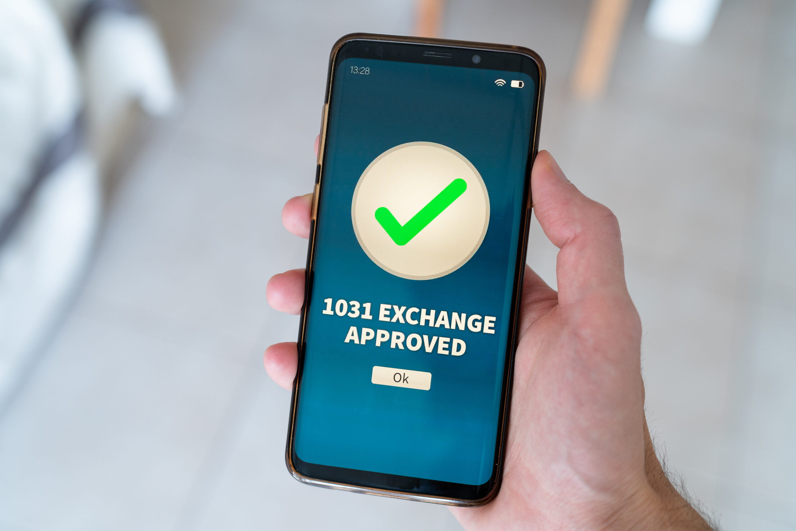 A 1031 exchange approved notification on smart phone.